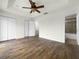 Large bedroom with double doors and wood flooring at 8863 White Sage Loop, Lakewood Ranch, FL 34202