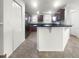 Modern kitchen with dark wood cabinets and granite countertops at 8863 White Sage Loop, Lakewood Ranch, FL 34202