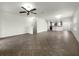Open living room with tile floors, high ceilings, and views of kitchen at 8863 White Sage Loop, Lakewood Ranch, FL 34202