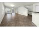 Open-concept living room with tile floors and access to balcony at 8863 White Sage Loop, Lakewood Ranch, FL 34202