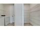 Laundry room with washer, dryer and shelving at 13844 Lilac Sky Ter, Lakewood Ranch, FL 34211