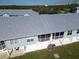 Aerial view showcasing the building's rear elevation and screened porch at 3919 Cape Haze Dr # 503, Rotonda West, FL 33947