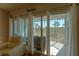 View from living room to balcony overlooking trees at 3919 Cape Haze Dr # 503, Rotonda West, FL 33947