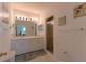 Bathroom with double vanity, shower, and beach decor at 3919 Cape Haze Dr # 503, Rotonda West, FL 33947
