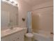 Clean bathroom with a tub shower, white vanity, and light tile at 3919 Cape Haze Dr # 503, Rotonda West, FL 33947