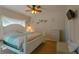Bedroom with a queen-size bed, dresser, and coastal decor at 3919 Cape Haze Dr # 503, Rotonda West, FL 33947