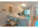 Bright kitchen with light cabinets, stainless steel appliances, and a breakfast bar at 3919 Cape Haze Dr # 503, Rotonda West, FL 33947