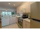 Kitchen with stainless steel appliances and light wood cabinets at 3919 Cape Haze Dr # 503, Rotonda West, FL 33947