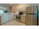 Clean kitchen with stainless steel appliances and light-colored cabinetry at 3919 Cape Haze Dr # 503, Rotonda West, FL 33947