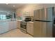 Kitchen with stainless steel appliances and light wood cabinets at 3919 Cape Haze Dr # 503, Rotonda West, FL 33947