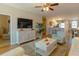 Spacious living room featuring comfortable seating and a large TV at 3919 Cape Haze Dr # 503, Rotonda West, FL 33947