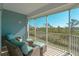 Relaxing screened porch with wicker furniture overlooking a wooded area at 3919 Cape Haze Dr # 503, Rotonda West, FL 33947