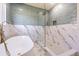 Spa-like bathroom with soaking tub, glass-enclosed shower, and elegant fixtures at 6370 Conniewood Sq, New Port Richey, FL 34653