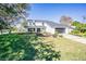 Attractive two-story home with a well-kept lawn and modern black trim at 6370 Conniewood Sq, New Port Richey, FL 34653