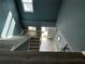 Bright foyer with staircase and modern flooring, showcasing a welcoming entrance at 6370 Conniewood Sq, New Port Richey, FL 34653