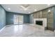 Elegant living room featuring a modern fireplace and sliding glass doors at 6370 Conniewood Sq, New Port Richey, FL 34653