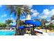 Community waterpark with swimming pool, water slide, and lighthouse-themed structure at 1070 Signet Dr, Apollo Beach, FL 33572