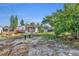 Spacious backyard with mature trees and open space at 990 Sunrise Dr, Tarpon Springs, FL 34689