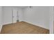 Bright bedroom with hardwood floors and an adjacent closet at 990 Sunrise Dr, Tarpon Springs, FL 34689