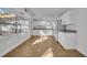 Open concept kitchen with white cabinets and granite countertops at 990 Sunrise Dr, Tarpon Springs, FL 34689