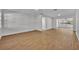 Spacious living room with light wood-look flooring at 990 Sunrise Dr, Tarpon Springs, FL 34689