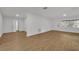 Spacious living area featuring hardwood floors and natural light at 990 Sunrise Dr, Tarpon Springs, FL 34689