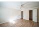 Spacious bedroom with walk-in closet and ceiling fan at 200 Country Club Dr # 1402, Largo, FL 33771