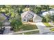 An aerial view showcases the home's location near a golf course and water feature at 5277 Epping Ln, Zephyrhills, FL 33541