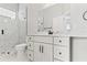 Bathroom featuring white vanity with drawers, a shower, and a toilet at 5277 Epping Ln, Zephyrhills, FL 33541