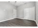 An empty bedroom with wood-look floors, a ceiling fan, and a closet at 5277 Epping Ln, Zephyrhills, FL 33541