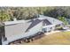Exterior aerial of a modern building, featuring a well-maintained lawn and surrounding golf course views at 5277 Epping Ln, Zephyrhills, FL 33541