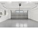 Garage interior featuring closed garage door at 5277 Epping Ln, Zephyrhills, FL 33541