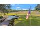 Golf course path with American flag at 5277 Epping Ln, Zephyrhills, FL 33541