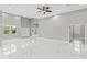 Spacious living room with recessed lighting, ceiling fan, and marble flooring at 5277 Epping Ln, Zephyrhills, FL 33541