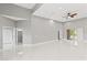 Expansive living area featuring high ceilings, recessed lighting, and pristine white marble floors at 5277 Epping Ln, Zephyrhills, FL 33541