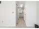 White kitchen with appliances and access from living room at 14201 Village View Dr # 1, Tampa, FL 33624