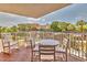 Private balcony with table and chairs, offering a relaxing space at 18400 Gulf Blvd # 1206, Indian Shores, FL 33785
