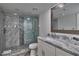 Spa-like bathroom with a frameless shower and marble tile at 18400 Gulf Blvd # 1206, Indian Shores, FL 33785