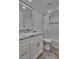Updated bathroom with white vanity, marble countertop, and walk-in shower at 18400 Gulf Blvd # 1206, Indian Shores, FL 33785