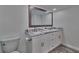 Double vanity bathroom with marble countertop and modern fixtures at 18400 Gulf Blvd # 1206, Indian Shores, FL 33785