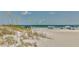 Beachfront view with dunes and calm ocean waves at 18400 Gulf Blvd # 1206, Indian Shores, FL 33785