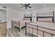 Guest bedroom with two beds and ceiling fan at 18400 Gulf Blvd # 1206, Indian Shores, FL 33785