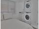 Bedroom with a stackable washer and dryer unit at 18400 Gulf Blvd # 1206, Indian Shores, FL 33785