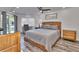 Main bedroom with a king-size bed and private balcony access at 18400 Gulf Blvd # 1206, Indian Shores, FL 33785