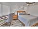 Bedroom with a queen-size bed, built-in desk, and calming decor at 18400 Gulf Blvd # 1206, Indian Shores, FL 33785