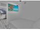 Guest bedroom with a TV and view of living area at 18400 Gulf Blvd # 1206, Indian Shores, FL 33785
