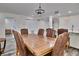 Dining room with rustic wood table and leather chairs at 18400 Gulf Blvd # 1206, Indian Shores, FL 33785