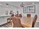 Dining room with rustic wood table and leather chairs at 18400 Gulf Blvd # 1206, Indian Shores, FL 33785