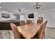 Spacious dining area with large wooden table and leather chairs at 18400 Gulf Blvd # 1206, Indian Shores, FL 33785