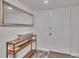 Bright entryway with wood shelf and large mirror at 18400 Gulf Blvd # 1206, Indian Shores, FL 33785